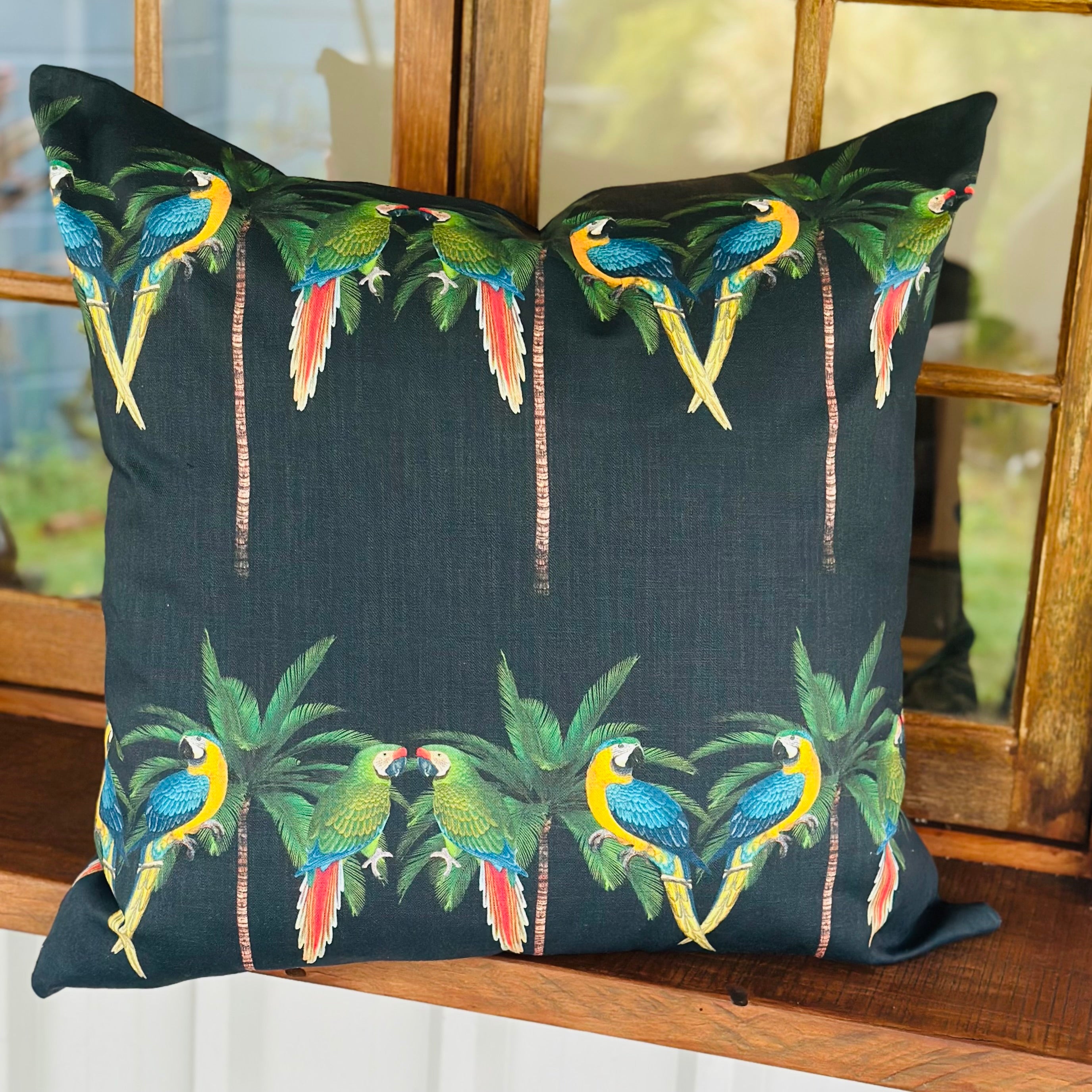 ijustlovethatfabricstore Parrots and Palms cushion cover on midnight black